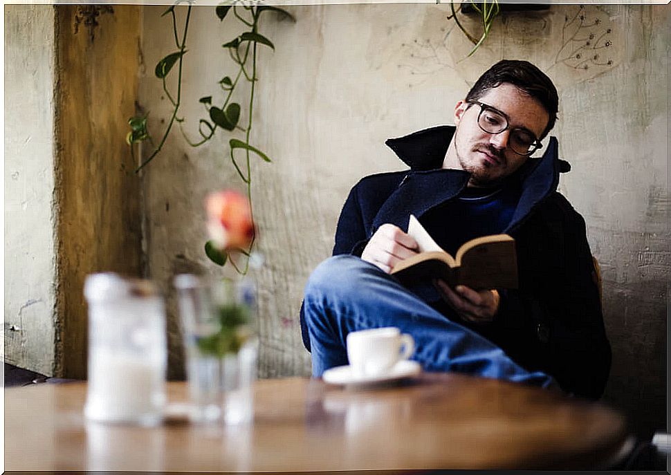 Boy reading a book at home.