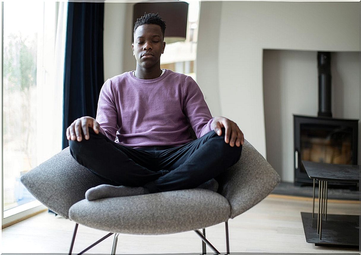 Teen boy carrying out some relaxation techniques.