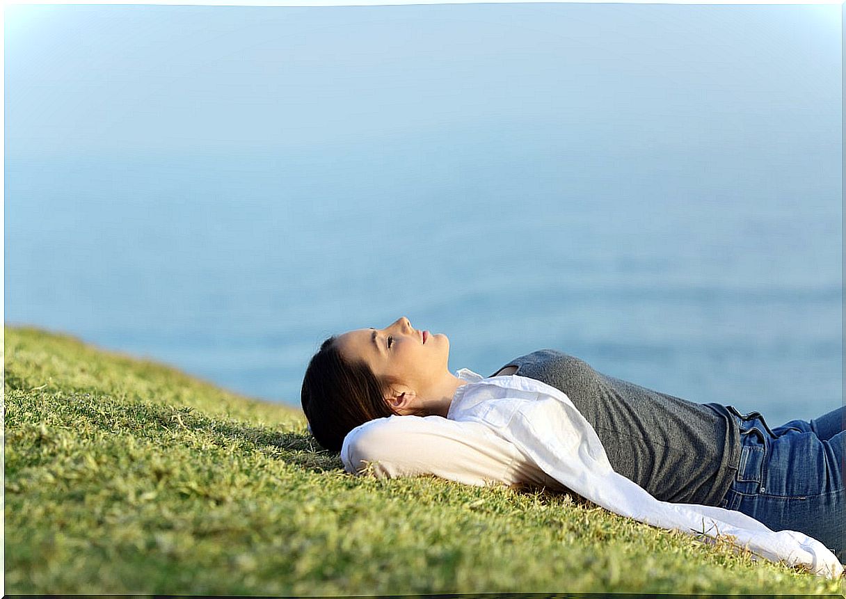 Teen girl practicing mindfulness in nature.