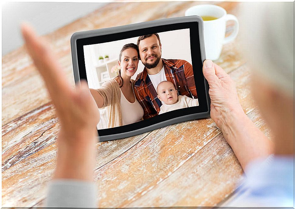 Grandmother talking to her family during the quarantine by video call.