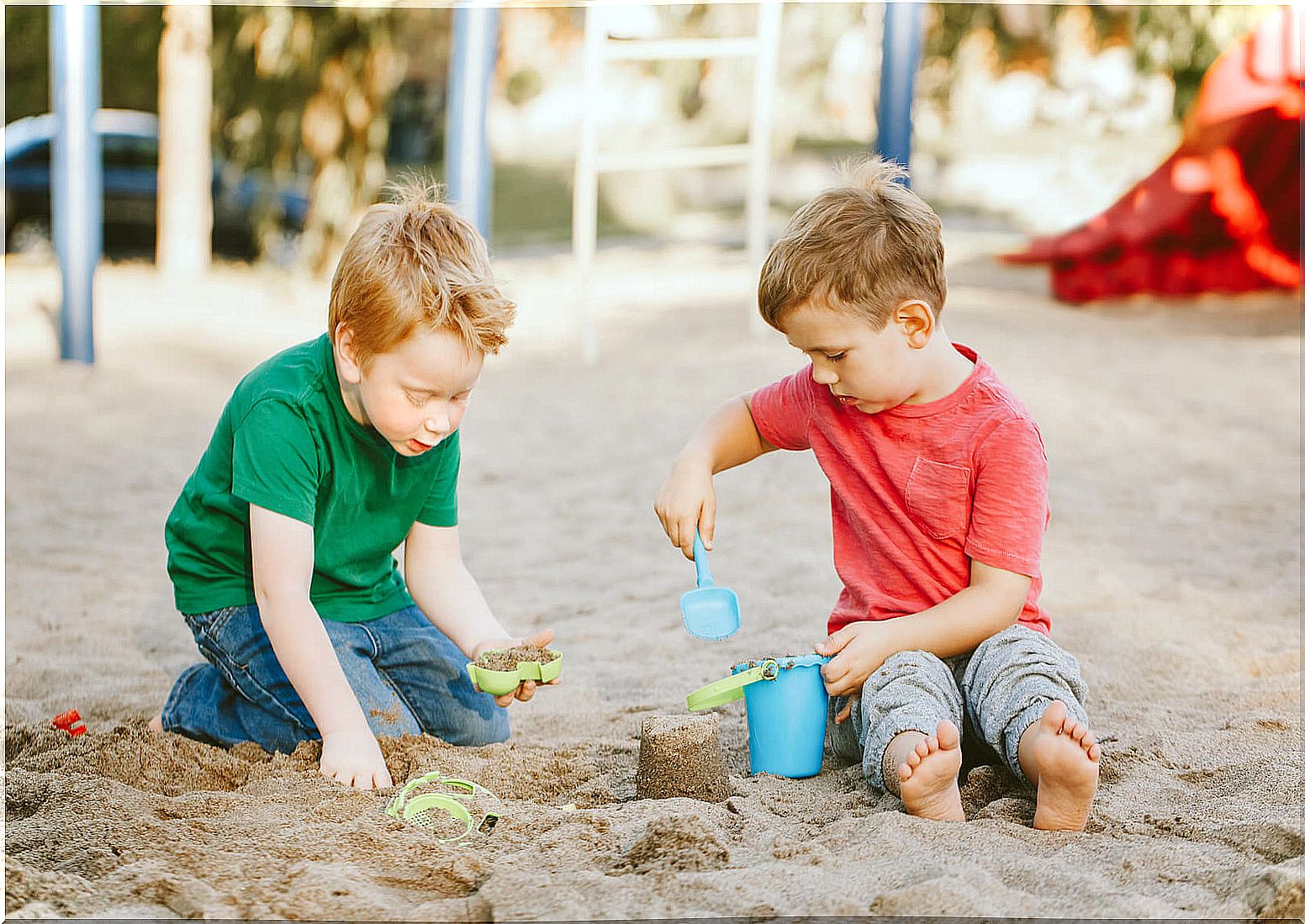 Child playing to make sand castle.