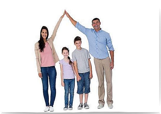 Happy parents joining hands above children