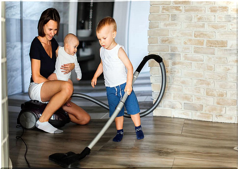 Boy helping his mother with housework during quarantine.