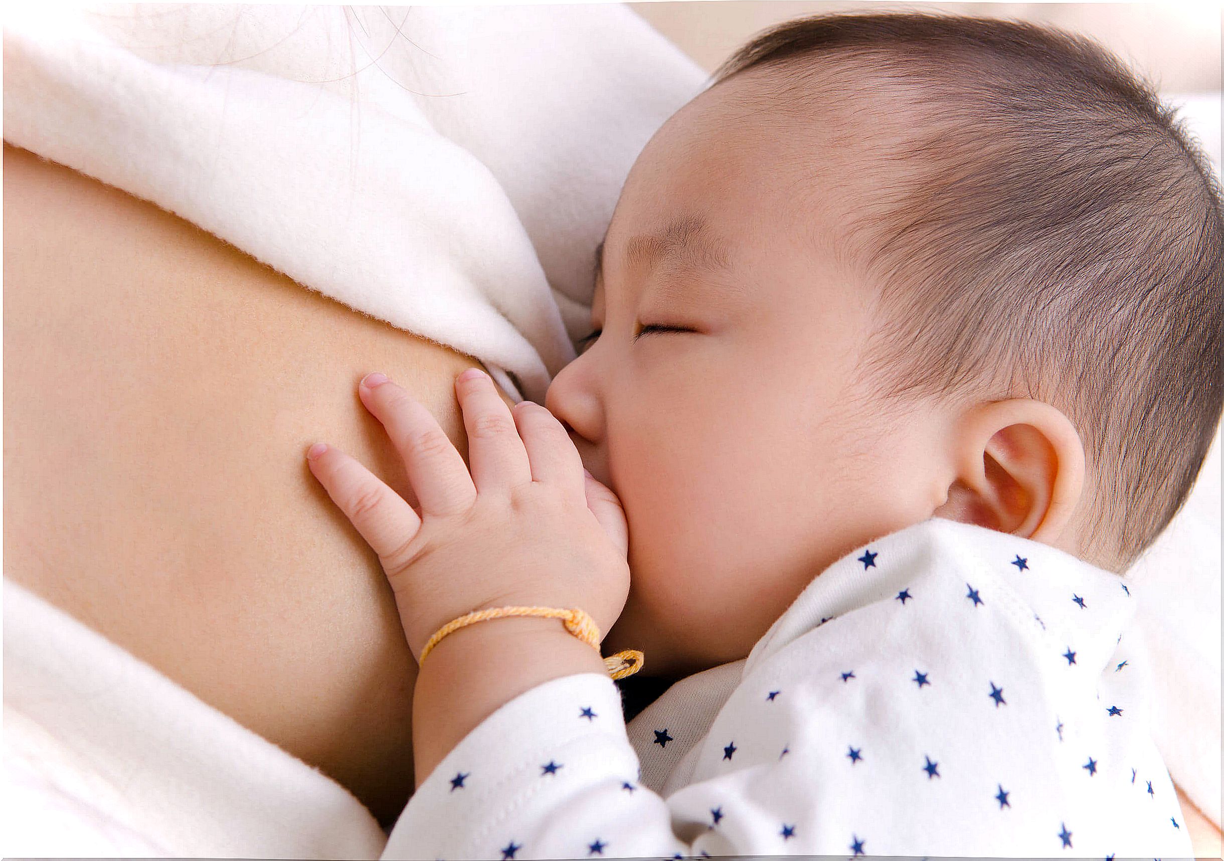 Mother breastfeeding her child.