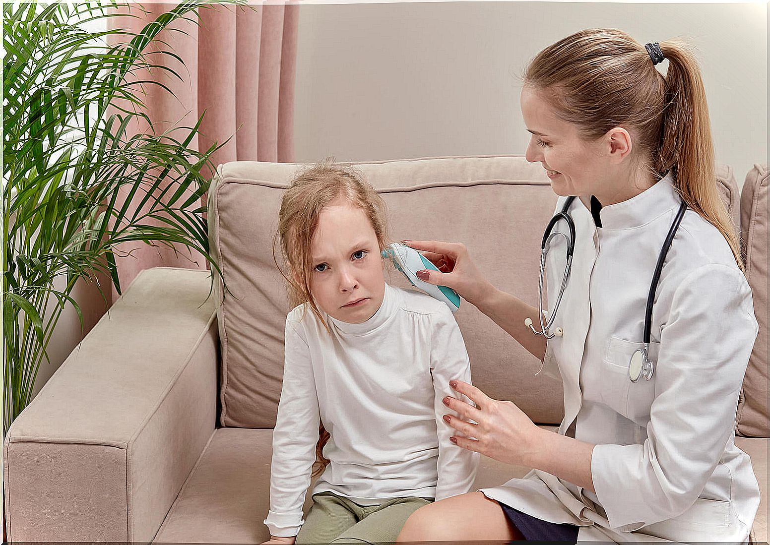 Little girl crying at the doctor's office because she is afraid of the pediatrician.