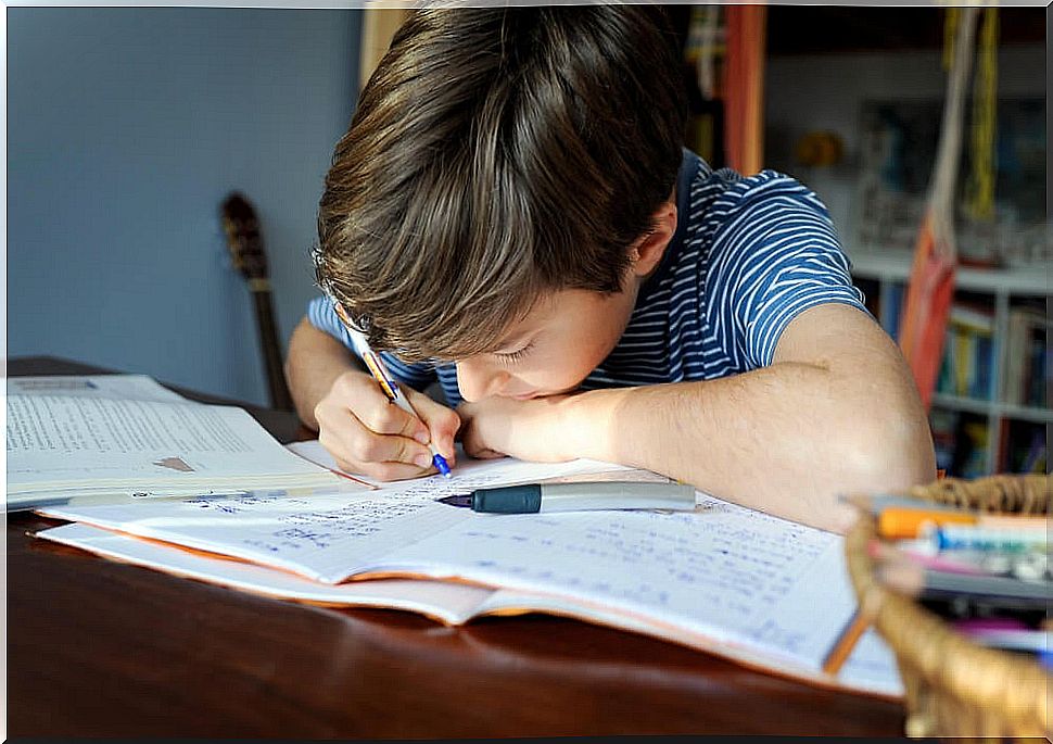 Boy doing hiatus and diphthong exercises in his room.