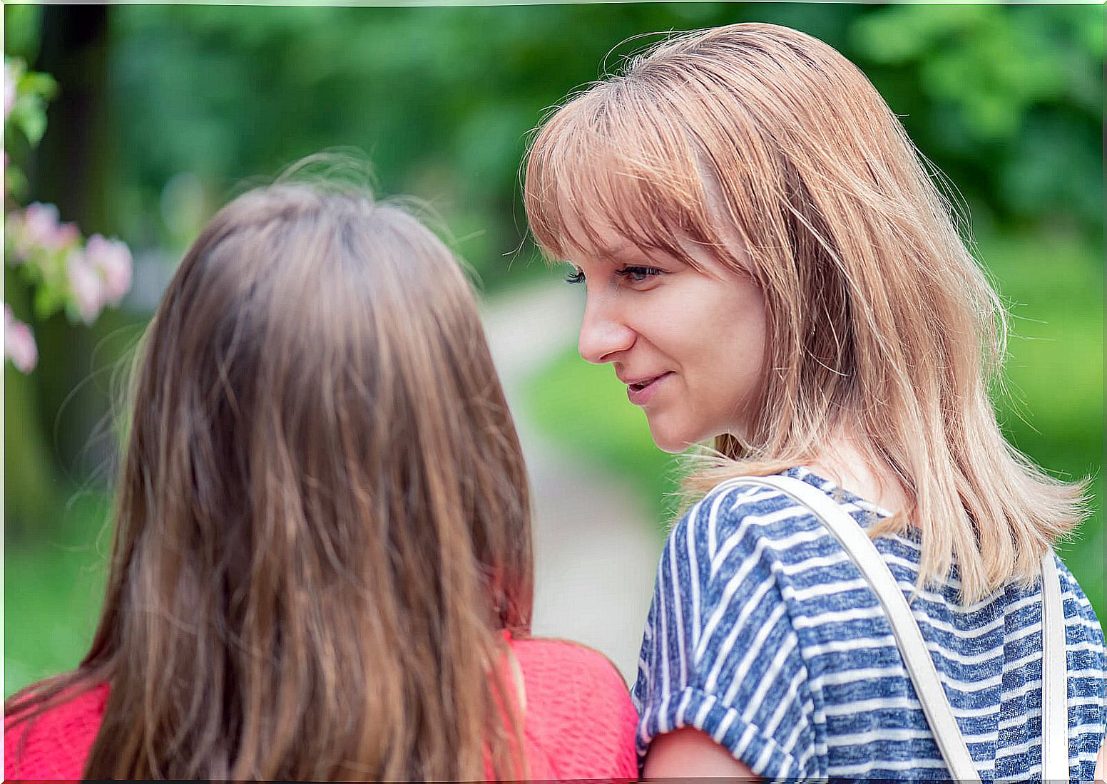 Mother talking with her daughter to find out if a relative has disavowed her in front of her son.