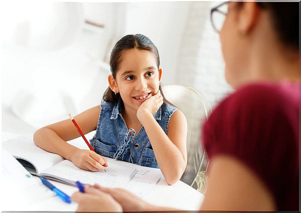 Girl in reinforcement class with her private teacher.