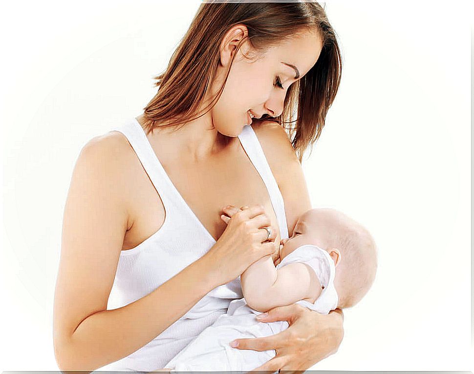 Mother breastfeeding her baby during breastfeeding and carrying out a natural upbringing.