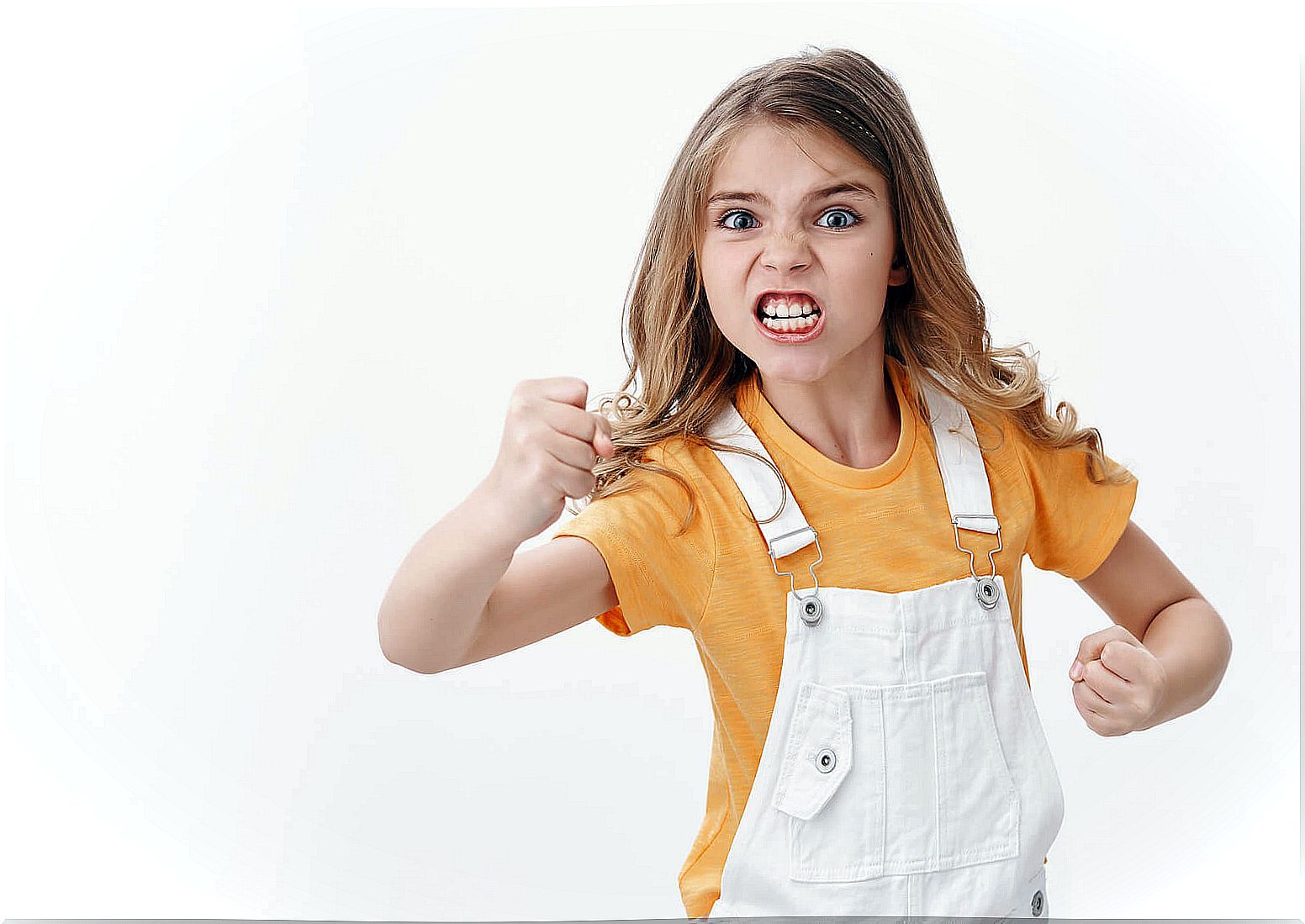 Adolescent girl with raised fists fighting with her parents as a form of abuse.