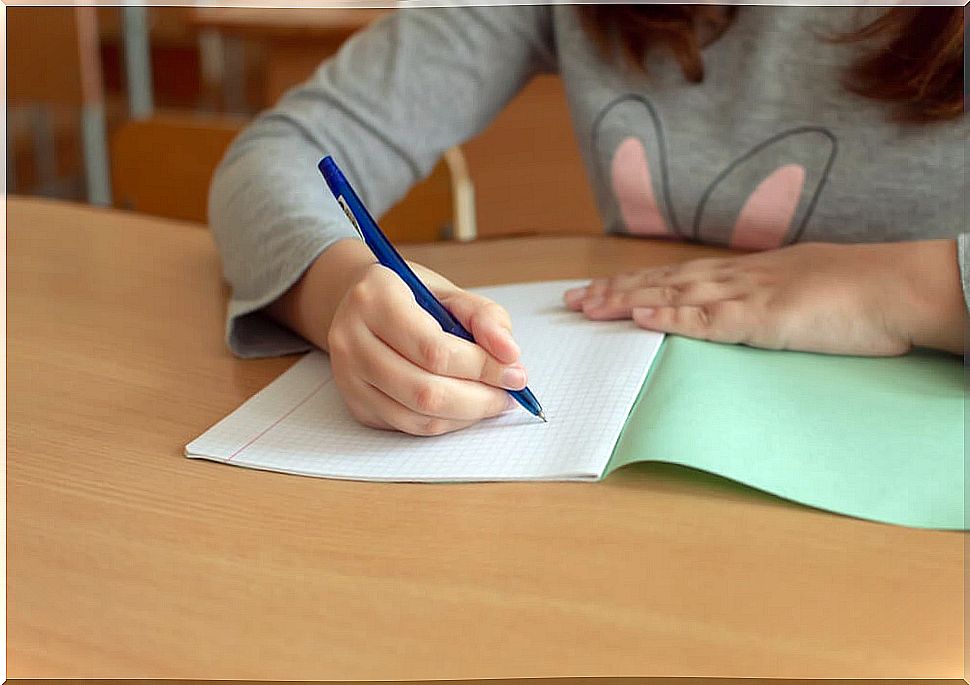 Little girl doing therapeutic writing exercises.