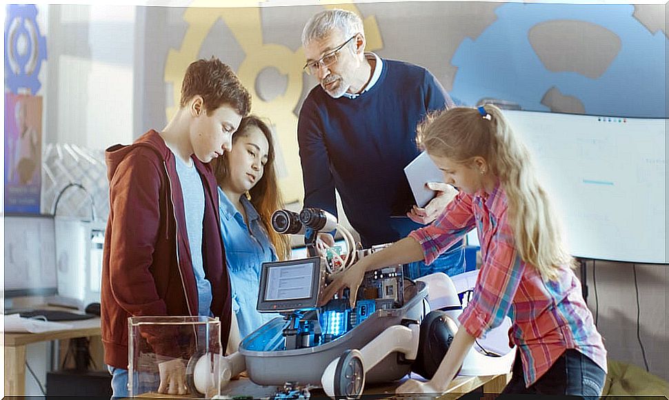 Teacher with his students in science and technology class.