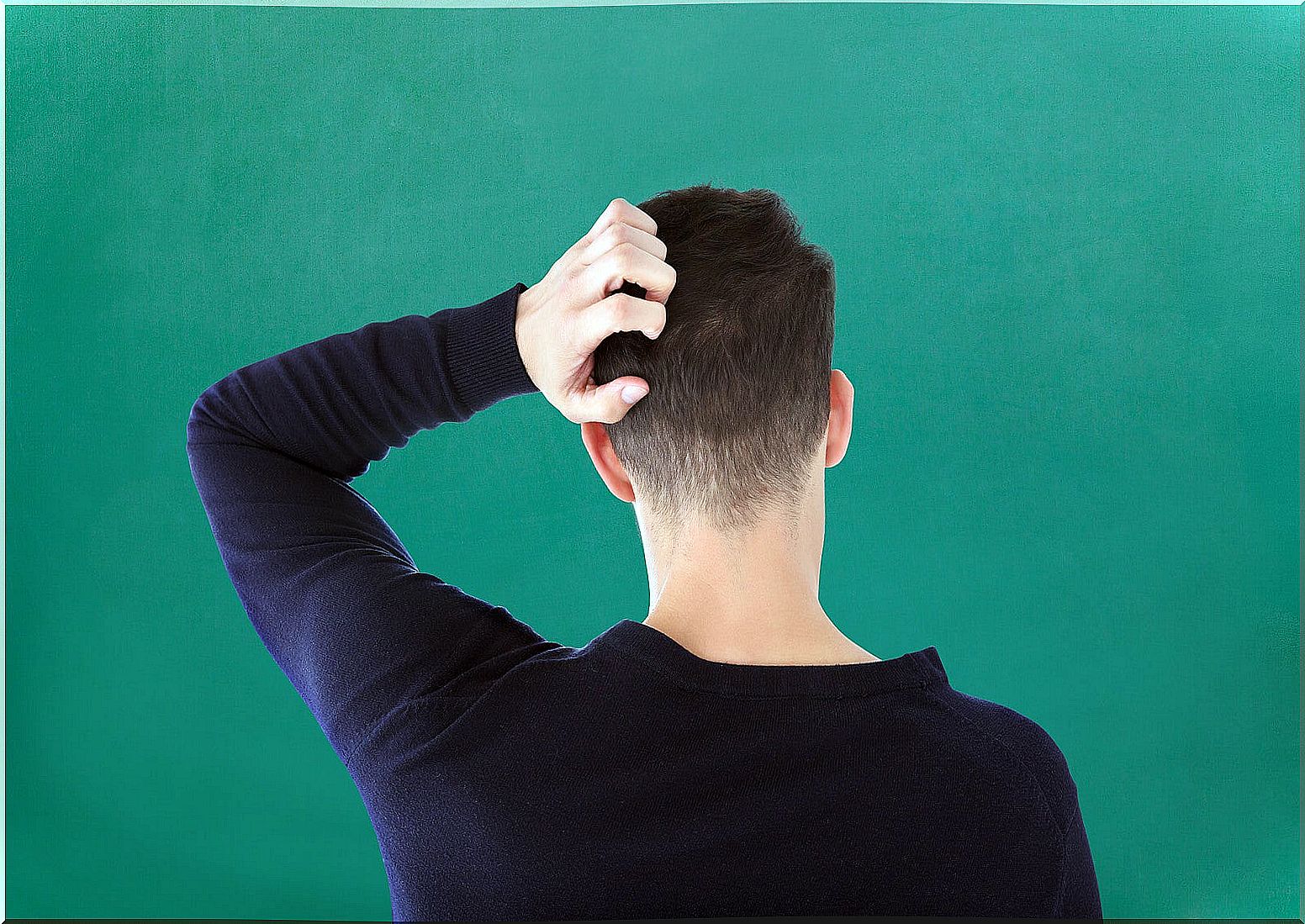 Boy with dandruff, one of the most common skin problems in teenagers.