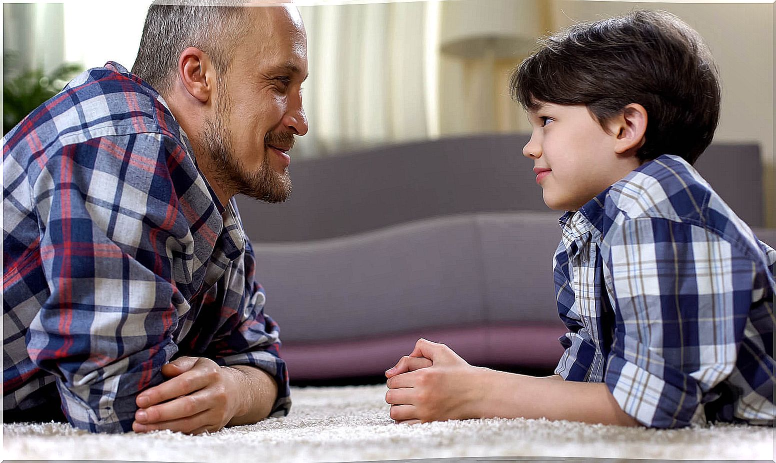 Father talking to his son to avoid the negative consequences of using reinforcement.