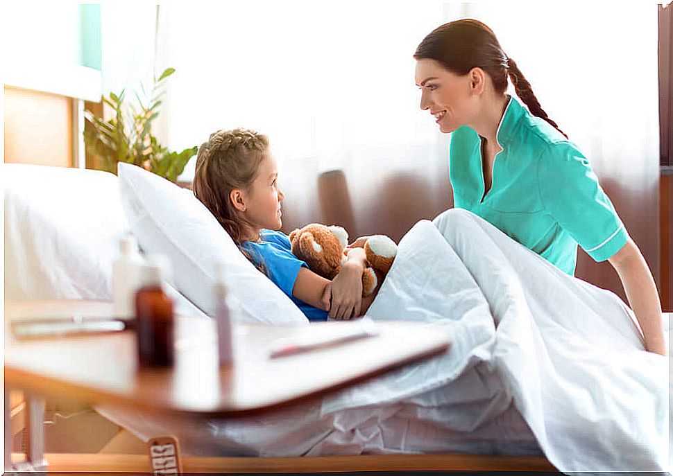 Mother and daughter talking at bedtime.